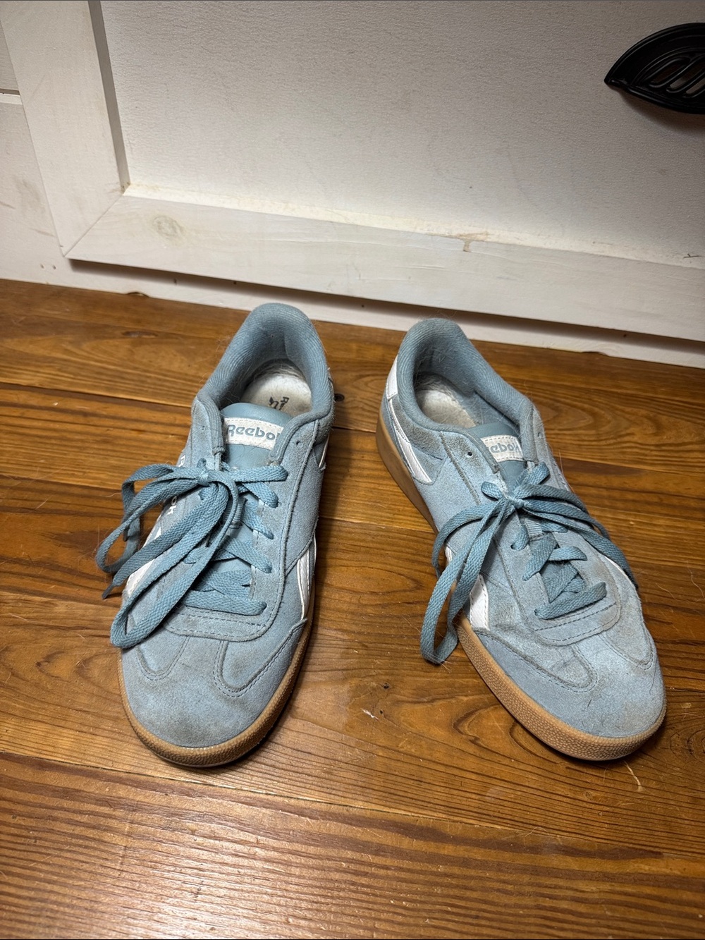 well loved broken in baby blue suede reebok sneakers